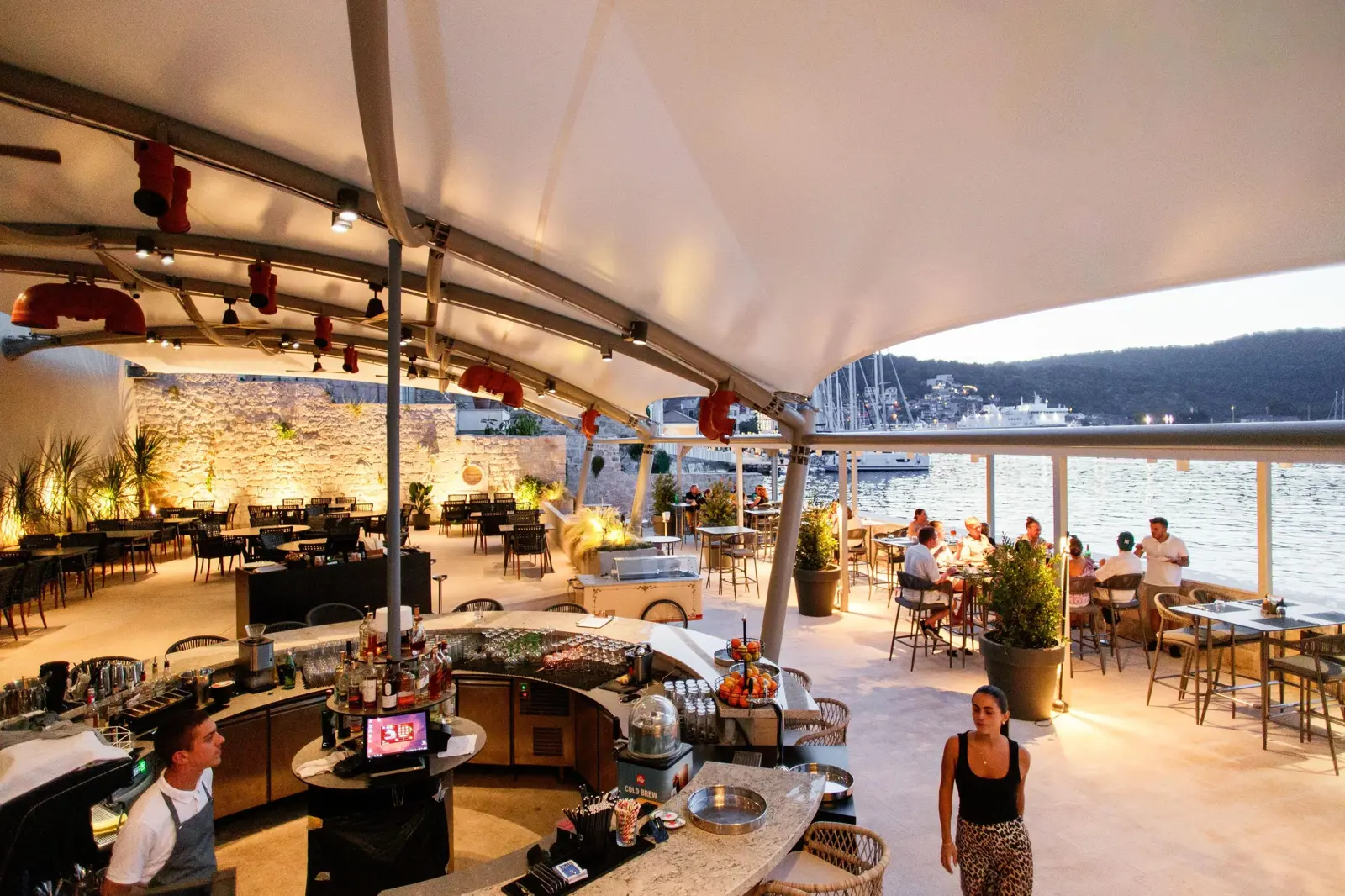 Spacious restaurant terrace at Marshal Club Hotel overlooking Vis harbor