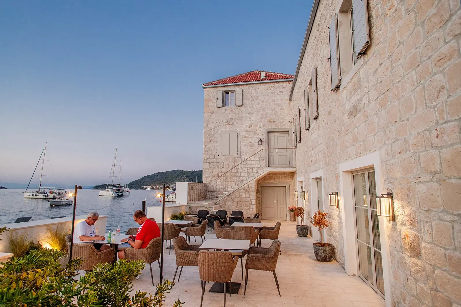 Evening atmosphere with soft lights on the terrace at Marshal Club Hotel Vis